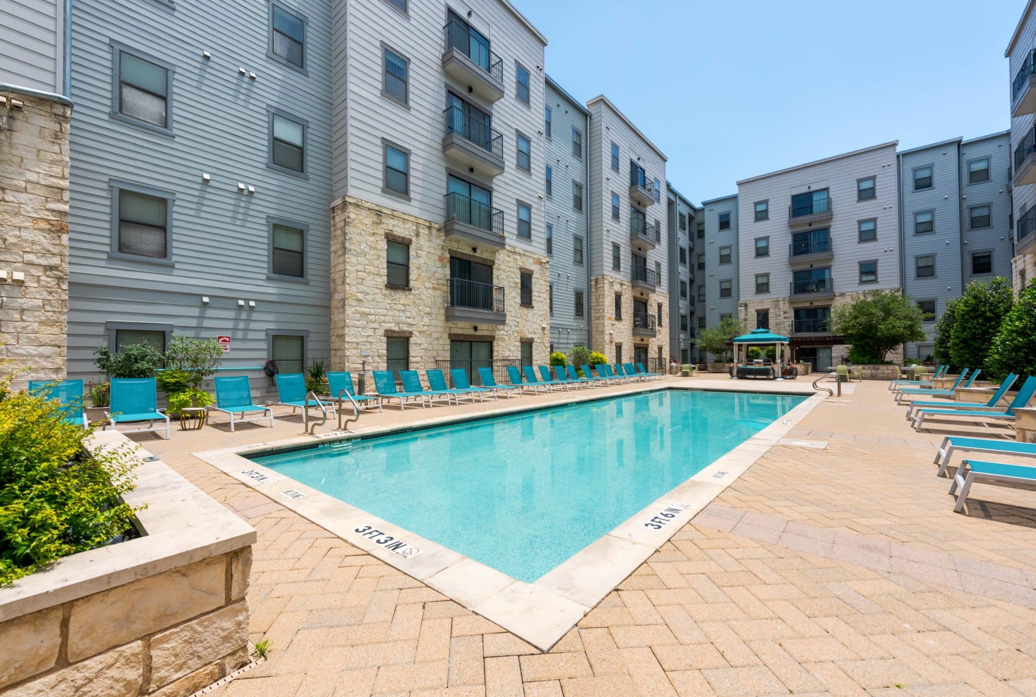 axis west campus apartments near ut austin resort style pool courtyard